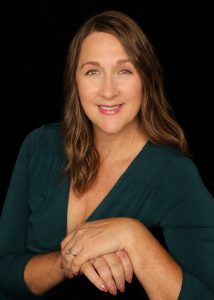 Picture of woman with long hair wearing green