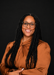 smiling woman with statement jewelry